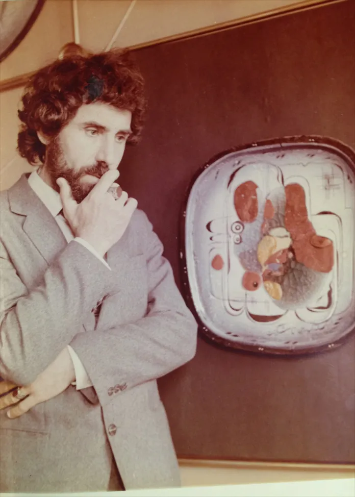 Alexander Kedrin beside one of his ceramic plates at an exhibition in Leningrad, 1983