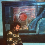 In front of large painting